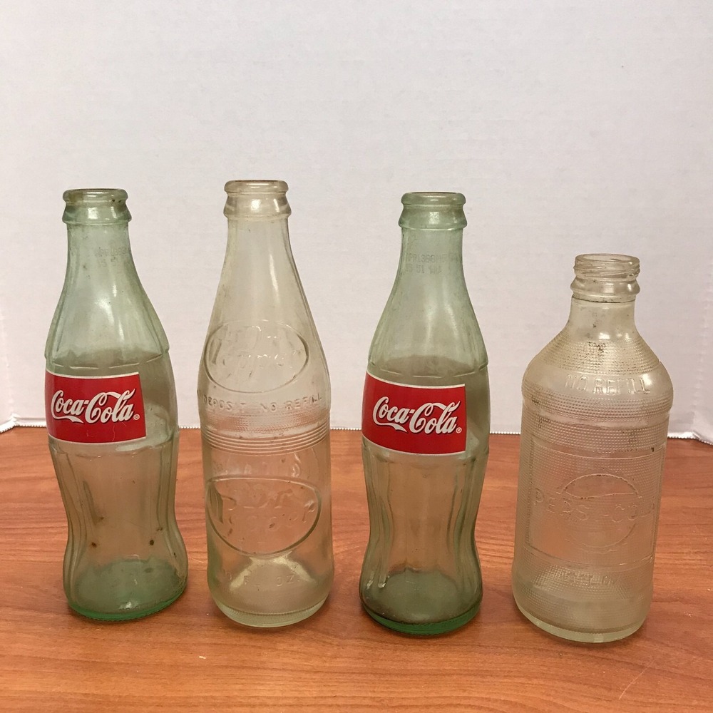 4 Vintage Soda bottles 2 Coke Pepsi and Dr Peper